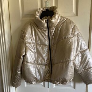 Puffer jacket in metallic fabric.